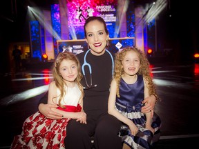 The Ottawa Hospital's Medicine Ball trophy winner Dr. Arleigh McCurdy and her daughters four-year-old Zoe (left) and six-year-old Madden.