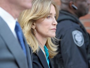 Actress Felicity Huffman exits the courthouse after facing charges for allegedly conspiring to commit mail fraud and other charges in the college admissions scandal at the John Joseph Moakley United States Courthouse in Boston on April 3, 2019.