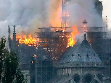 Flames rise during a fire at the landmark Notre-Dame Cathedral in central Paris on April 15, 2019 afternoon, potentially involving renovation works being carried out at the site, the fire service said.
