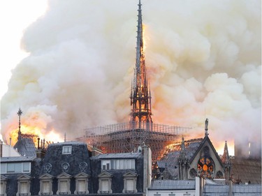 Smoke and flames rise during a fire at the landmark Notre-Dame Cathedral in central Paris on April 15, 2019, potentially involving renovation works being carried out at the site, the fire service said.