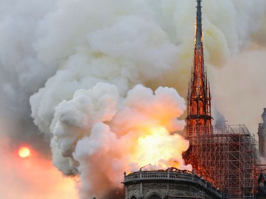 Smoke and flames rise during a fire at the landmark Notre-Dame Cathedral in central Paris on April 15, 2019, potentially involving renovation works being carried out at the site, the fire service said.