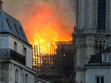 Smoke and flames rise during a fire at the landmark Notre-Dame Cathedral in central Paris on April 15, 2019, potentially involving renovation works being carried out at the site, the fire service said. - A major fire broke out at the landmark Notre-Dame Cathedral in central Paris sending flames and huge clouds of grey smoke billowing into the sky, the fire service said. The flames and smoke plumed from the spire and roof of the gothic cathedral, visited by millions of people a year, where renovations are currently underway.
