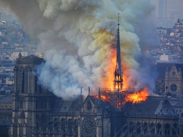 TOPSHOT - Smoke and flames rise during a fire at the landmark Notre-Dame Cathedral in central Paris on April 15, 2019, potentially involving renovation works being carried out at the site, the fire service said. - A major fire broke out at the landmark Notre-Dame Cathedral in central Paris sending flames and huge clouds of grey smoke billowing into the sky, the fire service said. The flames and smoke plumed from the spire and roof of the gothic cathedral, visited by millions of people a year, where renovations are currently underway.