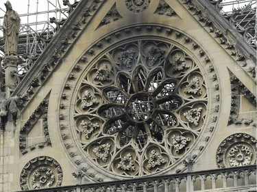 A picture shows the damage in the aftermath of a fire at Notre-Dame Cathedral in Paris, on April 16, 2019. - Crowds of stunned Parisians and tourists -- some crying, others offering prayers -- watched in horror in central Paris on April 15 night as firefighters struggled for hours to extinguish the flames engulfing the Notre-Dame Cathedral.