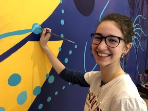 Alexandra Anawati-Gingras works on the butterfly mural she and her classmates in the ODCSB’s Specialist High Skills Major program created at St. Laurent Mall.