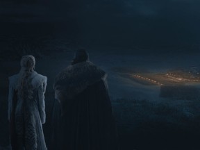 Jon Snow and Daenerys watch from afar as Winterfell lights up, prepared to face the Night King and his army.