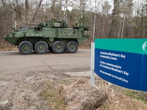 The Canadian Army has arrived in Constance Bay as a light armoured vehicle (LAV) drives in front of the community centre on Friday morning.