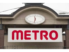 The logo of a Metro grocery store is seen in Montreal on January 31, 2012. Grocery chain Metro Inc. will allow customers to use reusable containers and zipper bags to purchase fresh products in stores across Quebec.THE CANADIAN PRESS/Paul Chiasson