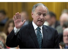Minister of Justice Rob Nicholson responds to a question during Question Period in the House of Commons in Ottawa, Wednesday May 9, 2012. The federal Liberals says Conservative MPs are purposely misleading their constituents about the existence of the new carbon tax rebate and may end up depriving people of money they are entitled to receive.