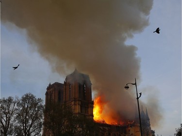 Notre Dame cathedral is burning in Paris, Monday, April 15, 2019. A catastrophic fire engulfed the upper reaches of Paris' soaring Notre Dame Cathedral as it was undergoing renovations Monday, threatening one of the greatest architectural treasures of the Western world as tourists and Parisians looked on aghast from the streets below.