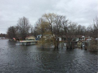 Water inundates a glassed sun room and shoreline on Mitchell Lane where Mississippi Lake narrows to a river again at Highway 7 in Carleton Place on Saturday, April 27, 2019.