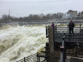A couple watches as the Mississippi River plunges through the narrow gorge in Almonte on Saturday, April 27, 2019.
