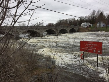 The Mississippi River rushed under the historic Five Arches Bridge in Pakenham on Satruday, April 27, 2019.