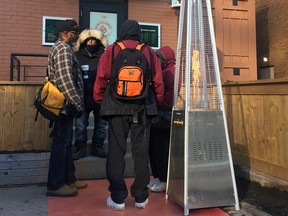 People line up outside Fire & Flower on opening day.