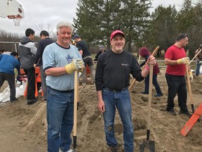 Ken Lloyd and Derek_Pickell spent their Easter Sunday shovelling sand.