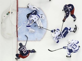 Columbus Blue Jackets' Oliver Bjorkstrand, bottom left, of Denmark, scores against Tampa Bay Lightning's Andrei Vasilevskiy, of Russia, during the second period of Game 4 of an NHL hockey first-round playoff series, Tuesday, April 16, 2019, in Columbus, Ohio.