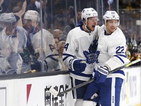 The Toronto Maple Leafs' Auston Matthews (34) celebrates his goal with Nikita Zaitsev during the third period in Game 5 in Boston on Friday, April 19, 2019.