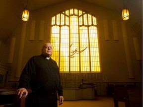 Father Pierre Champoux inside St. Margaret Mary Church on Fairbairn Avenue in Old Ottawa South as it gets set to close.