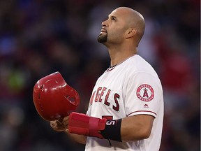 Los Angeles Angels' Albert Pujols looks toward the sky after hitting an RBI double during the third inning of a baseball game against the Seattle Mariners Saturday, April 20, 2019, in Anaheim, Calif. With that RBI, Pujols tied Babe Ruth for fifth place on the all-time RBI list with 1,992.
