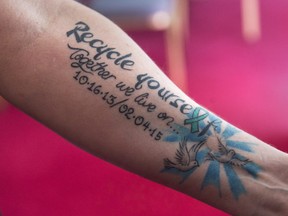 Cindy Ryan displays the tattoo that marks her two liver transplants as she attends a bill briefing at the legislature in Halifax on Tuesday, April 2, 2019.