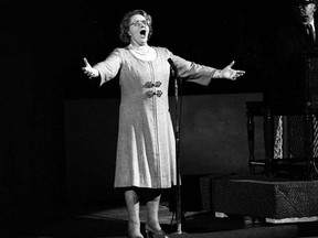 FILE - In this May 13, 1975, file photo, Kate Smith sings "God Bless America" before an NHL hockey Stanley Cup playoff game between the New York Islanders and the Philadelphia Flyers in Philadelphia. The New York Yankees have suspended the use of Smith's recording of "God Bless America" during the seventh-inning stretch while they investigate an allegation of racism against the singer. (AP Photo, File)