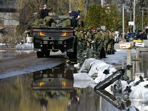 Canadian soldiers work to hold back floodwaters on the Ottawa River in Constance Bay on Monday, April 29, 2019.