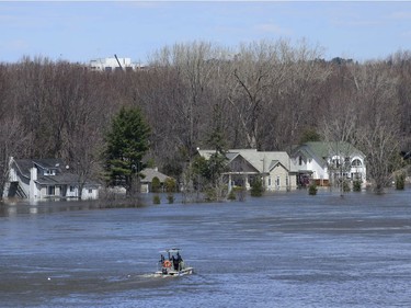 Homes along the Ottawa River in Gatineau, Quebec are flooded on Tuesday, April 30, 2019.