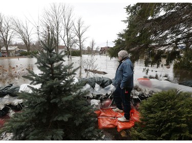 Glen Roberts looks at the rising waters of the Ottawa River from his home on Armstrong Road in Cumberland Saturday April 27, 2019.