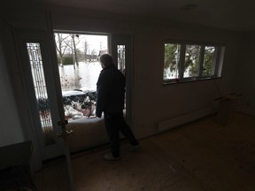 Glen Roberts looks out his front door to the rising waters of the Ottawa River on Armstrong Road in Cumberland Saturday April 27, 2019.