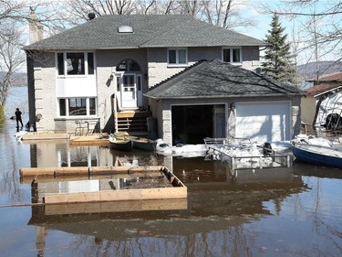 Media traveling with the Canadian Armed Forces during a flooding tour of Constance Bay in Ottawa Tuesday April 30, 2019. Members got a opportunity to watch the Canadian Armed Forces flood relief operations Tuesday. A home owner looking at the rising river Tuesday.