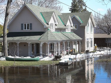 Water continued to rise in Constance Bay on Tuesday and the city announced a voluntary evacuation of about 150 homes along Bayview Drive.