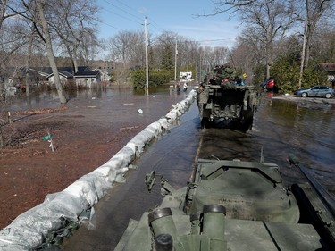 Media traveling with the Canadian Armed Forces during a flooding tour of Constance Bay in Ottawa Tuesday April 30, 2019. Members got a opportunity to watch the Canadian Armed Forces flood relief operations Tuesday.