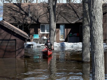 Water continued to rise in Constance Bay on Tuesday and the city announced a voluntary evacuation of about 150 homes along Bayview Drive.