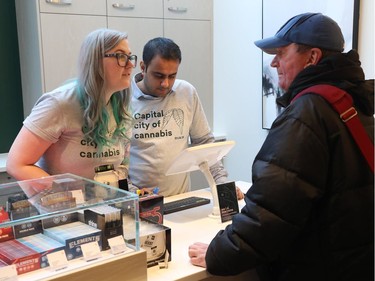 Media and customers attend the grand opening of Fire & Flower, a new pot shop which opened up at 129 York Street in Ottawa Monday April 1, 2019. Customers getting served Monday.