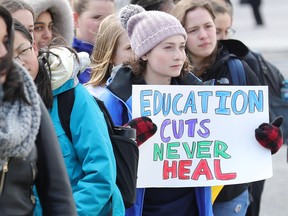 A couple hundred kids walk out of Colonel By High School in Ottawa.