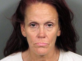 This booking photo released by Riverside County Animal Services on Tuesday, shows Deborah Sue Culwell. The California woman could face up to seven years behind bars on a slew of charges filed Tuesday after authorities say surveillance video showed her casually tossing a bag of 3-day-old, palm-sized puppies into a trash can on a sweltering day.