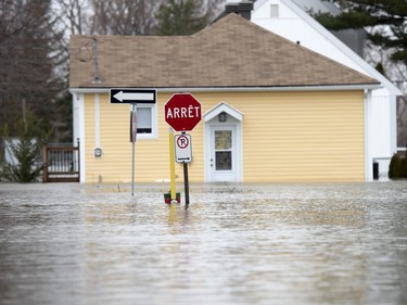Water covers Rue Rene in Gatineau, Que. as flooding from the Ottawa River continues to affect the region on Saturday, April 27, 2019.