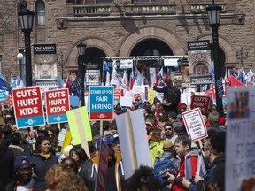 Thousands of teachers, students and unions protest various education cuts at Queen's Park earlier this month.