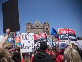 A large crowd gathers at Queen's Park to protest the provincial government's recently announced changes to education during the Rally for Education in Toronto on Saturday, April 6, 2019. (THE CANADIAN PRESS/ Tijana Martin)