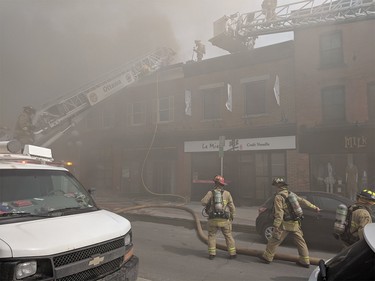 Scott Stilborn
Ottawa Fire on scene on a 2-Alarm fire at 35 William Street in the Byward Market. Fire is extending through the common cockloft to two attached buildings. Crews are being evacuated from the roof and interior due to rapidly deteriorating conditions.