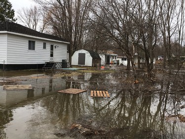 Residents on Leo Lane in Cumberland canoes to dike around home