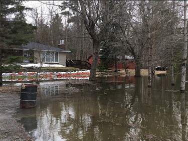 Residents on Leo Lane in Cumberland canoes to dike around home
