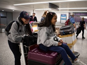 Vanessa Mae Rodel and her daughter Keana Nihinsa (7), arrive at Toronto Pearson International Airport on March 25, 2019.