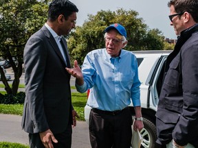 Rep. Ro Khanna, D-Calif., talks to Bernie Sanders before the senator from Vermont takes the stage. In Sanders, Khanna, whose district includes Silicon Valley, found a candidate who shared his diagnosis of the country's most vexing problems: inequality and the failures of unrestrained capitalism. MUST CREDIT: Photo by Nick Otto for The Washington Post
