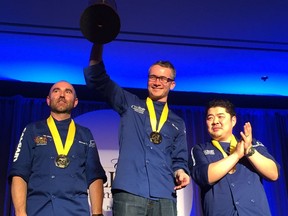 (L-R) Silver medallist Mathew Batey of Calgary stands next to gold medallist Marc Lepine of Ottawa and Alex Chen of Vancouver stand with their medals during the Canadian Culinary Championships  in Kelowna, B.C., on Sunday, Feb. 7, 2016.