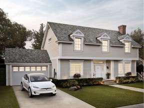 Unlike conventional solar panels which some consider unsightly, a Tesla solar roof using slate-style shingles have the look of a conventional roof.