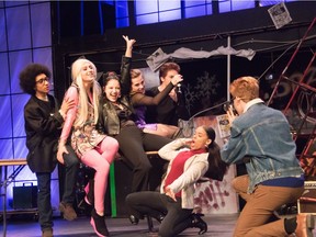 Tom played by Tobias Selman (L), Angel played by Liam Greig (2ndFL), Maureen played by Neve Maltus (3rdFL), Mimi played by Lucia Foster (C), Roger played by Zach Malesevic (3rdFR), Joanne plaed by Ocean Williams (2ndFR), and Mark played by Noah Poitras (R), during Philemon Wright's Cappies production of the Rent, on April 13, 2019, in Gatineau, QC.