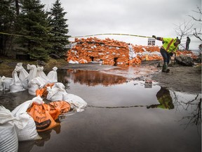 Crews were on site of the berm near Jamieson Street along the Ottawa River in the Britannia area, Thursday, May 2, 2019.