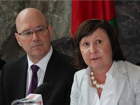 While Minister of Municipal Affairs and Housing Steve Clark looks on, County of Renfrew Warden Jennifer Murphy addresses the media at a briefing at the Renfrew County administration building regarding the current state of flooding in the area on Friday, May 3.