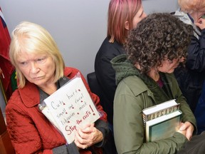 Residents of Stratford, St. Marys, and Perth County gathered inside Perth-Wellington MPP Randy Pettapiece's Stratford office Friday afternoon to protest recent cuts to the Ontario's public library system.